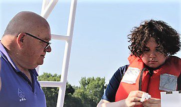 Dave Kuzminski with water boot camp student