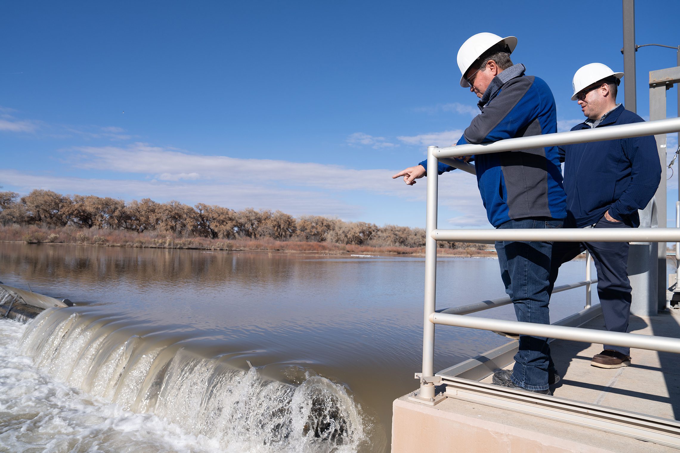 Men Overlooking Water