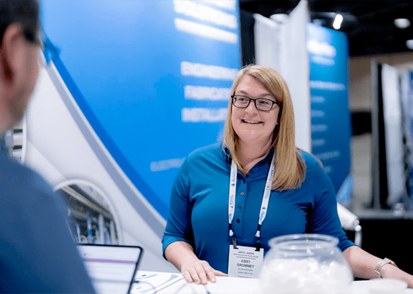 blonde-woman-at-booth