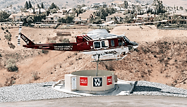 Firefighting helicopter pulls water from a Yorba Linda Water District heli-hydrants