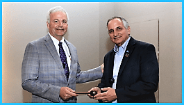 AWWA President Pat Kerr receives gavel from Immediate Past President Joe Jacangelo