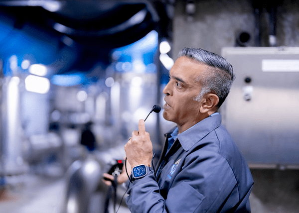 man-speaking-into-microphone