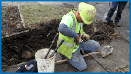 Utility worker replaces lead service line